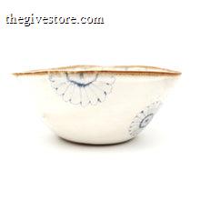 Ceramic bowl with blue floral patterns on a white background