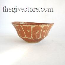 Ceramic bowl with a textured surface on a white background