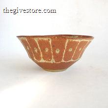 Ceramic bowl with a textured brown surface on a white background