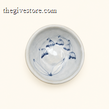 White ceramic bowl with blue decorative elements on a white background