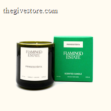 Candle with 'Flamingo Estate' branding next to a green box on a white background