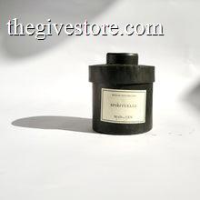 Black metal cylinder Mad et Len Candle Apothicaire Petite - SPIRITUELLE. Matching lid covering the candle. 