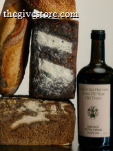 Flamingo Estate Heritage Extra Virgin Olive Oil bottle with country bread loafs