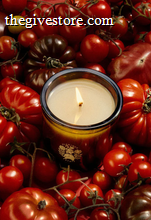 Flamingo Estate candle in a bed of heirloom tomatoes 