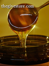 Spoon drizzling honey